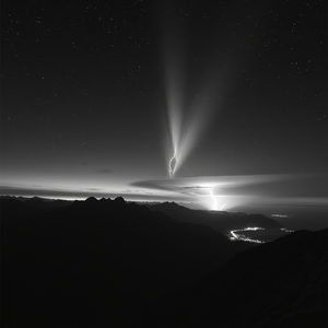 realistic photo, a meteor shower over mountains, at sunset, with lightning in distance, monochrome black and white, low angle dramatic perspective, neon glow, award-winning composition, awe-inspiring and grand